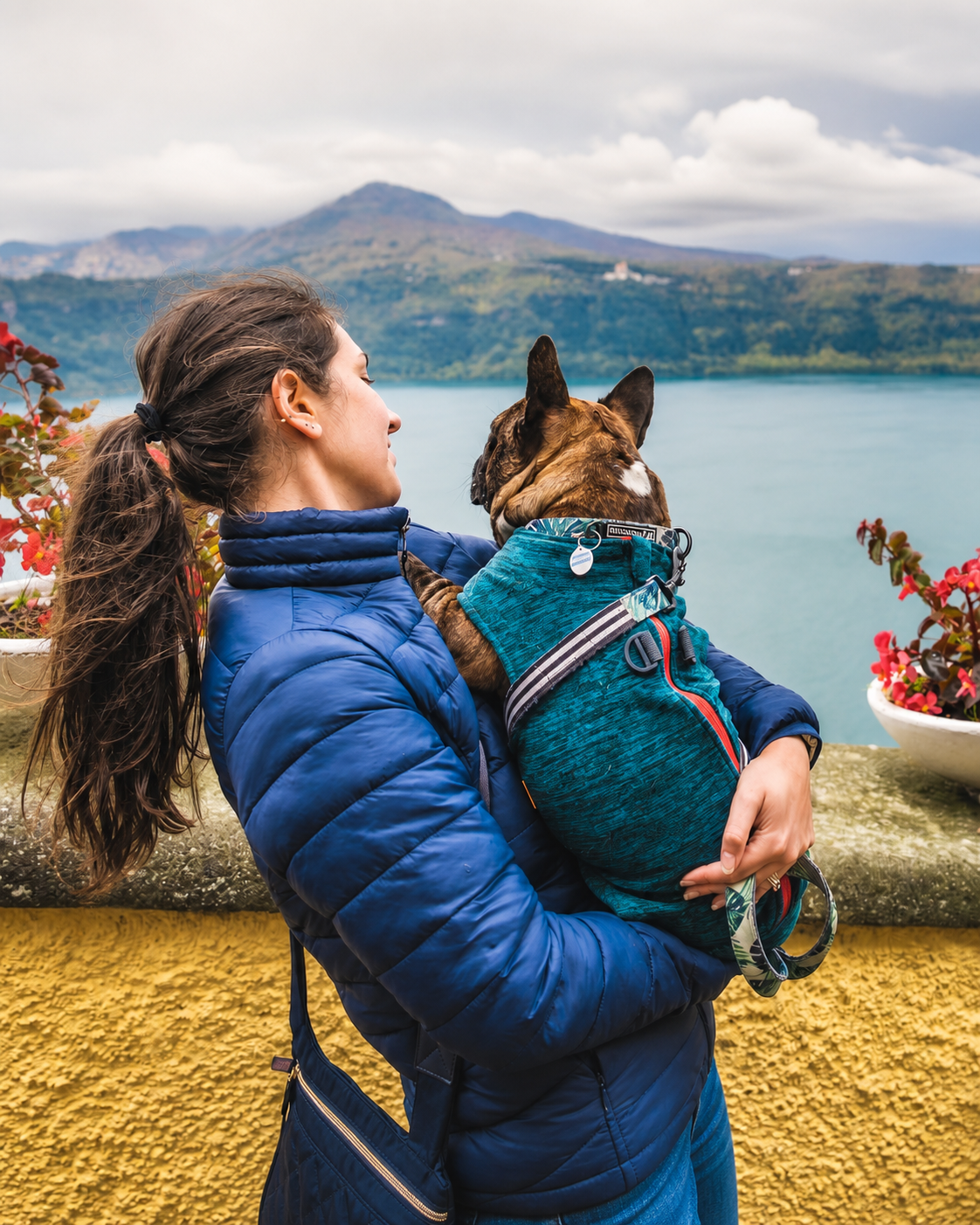 Frederika Onofrejová holding Gaston beside a lake
